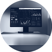Computer monitor displaying financial spreadsheets and bar charts in forensic accounting analysis