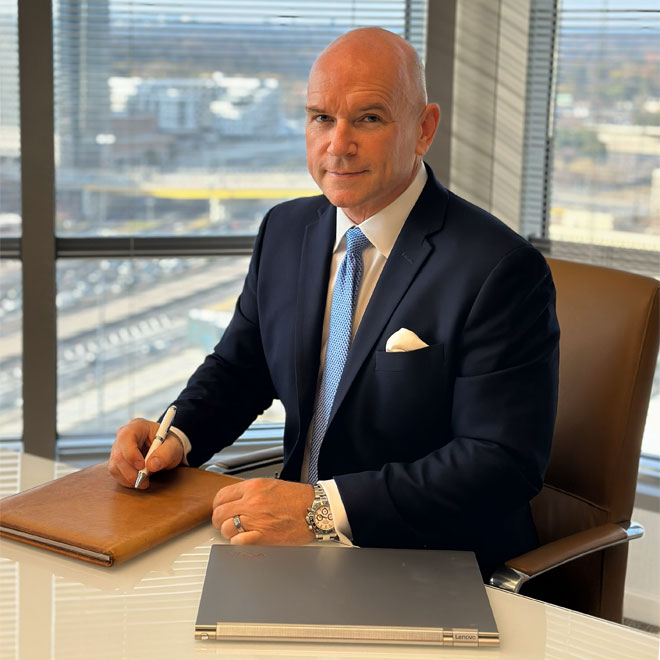 Richard Drye, CPA - Headshot in office with windows in the background showing Atlanta, Georgia.